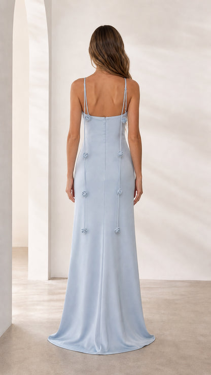 Back view of light blue formal gown with trailing floral details