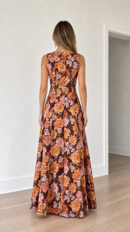 Back view of woman wearing burgundy floral print maxi dress