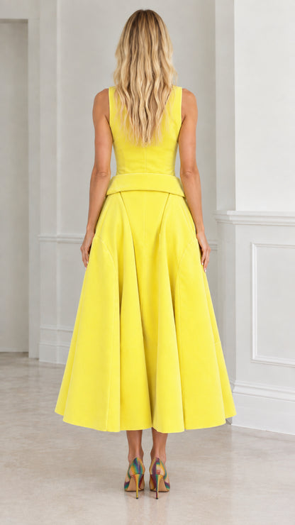 Back view of yellow sleeveless midi dress showing fitted bodice