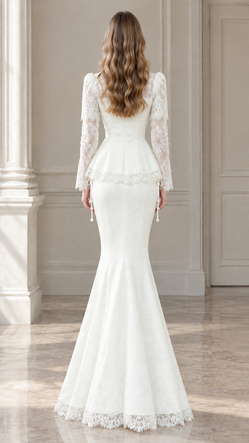 Back view of model wearing white lace mermaid gown showcasing fitted silhouette