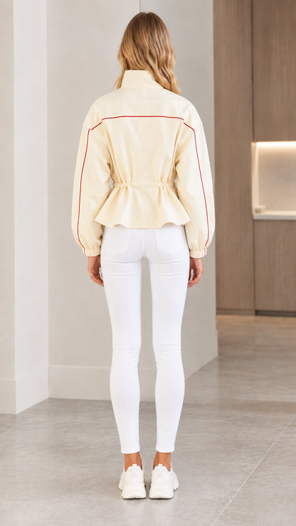 Back view of cream drawstring waist jacket showing clean back seam detail