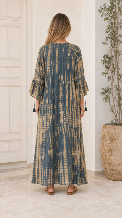 Back view of model wearing Blue tie-dye maxi dress