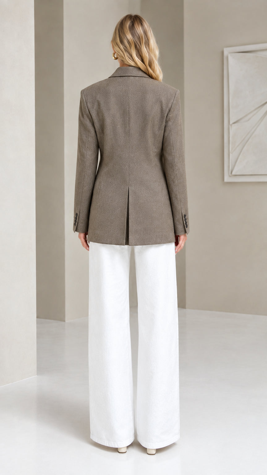Back view of taupe wrap blazer highlighting center back vent