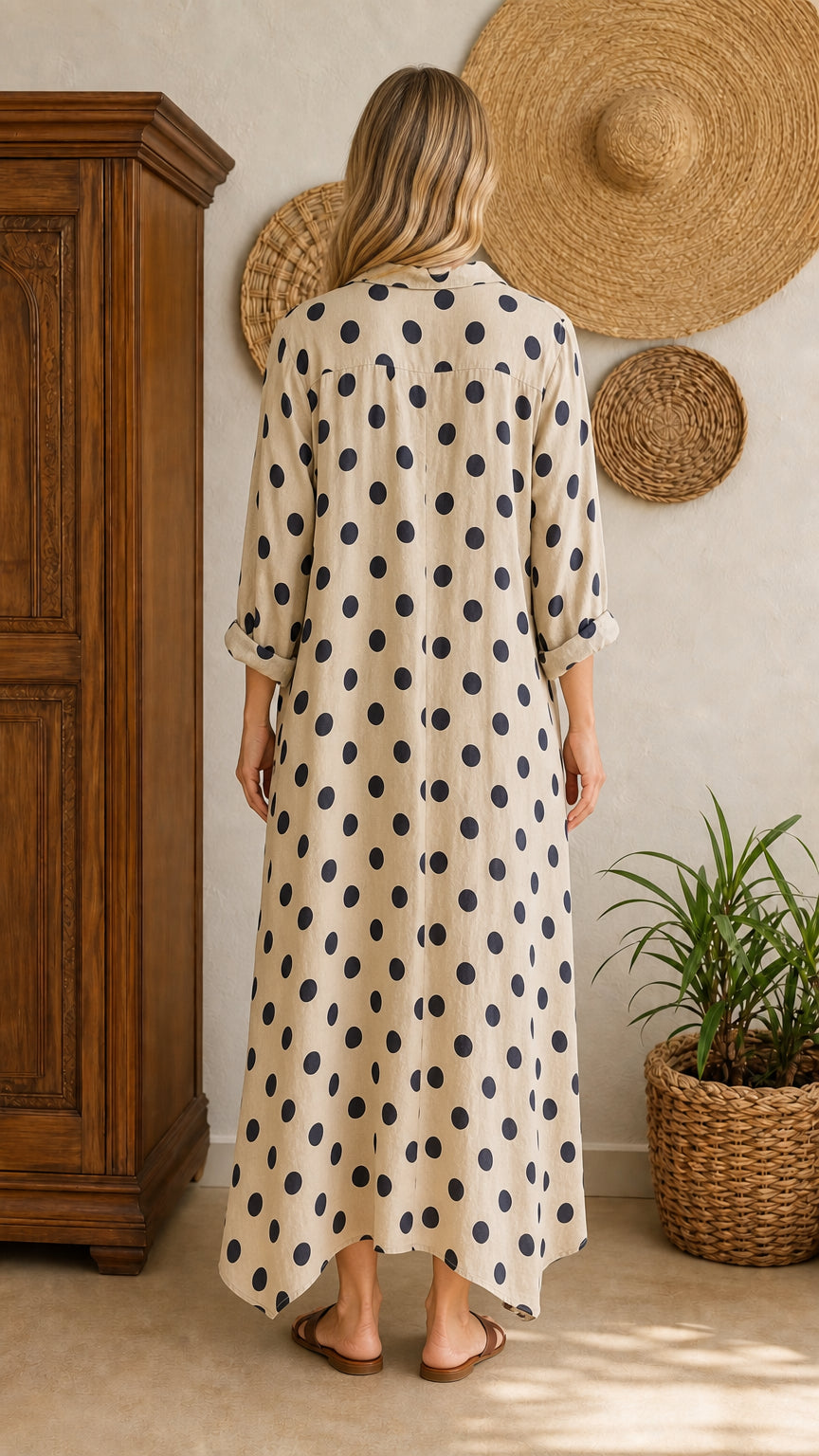 Back view of beige polka dot maxi shirt dress on model