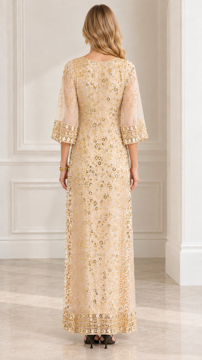 Back view of model wearing Champagne gold sequined floor-length dress