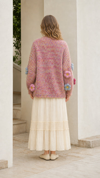 Model wearing pink floral cardigan from the back