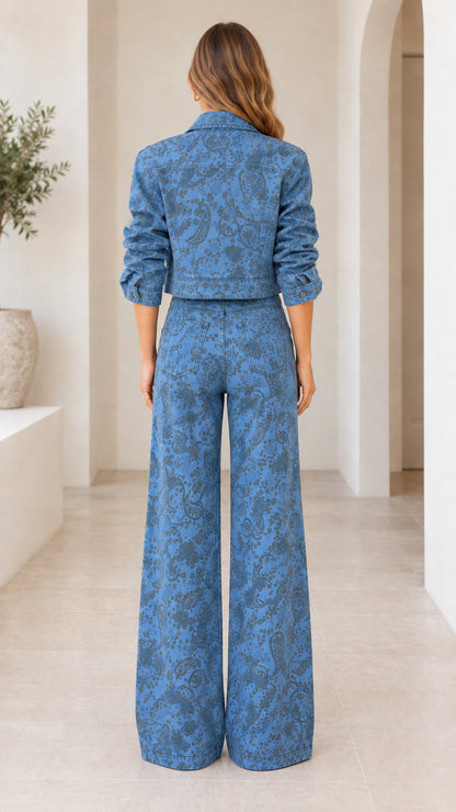 Back view of model wearing Denim Blue paisley print cropped jacket and wide-leg pants