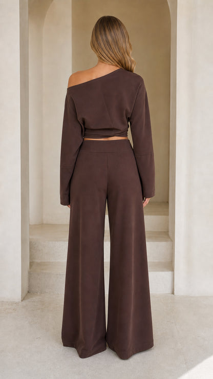 Back view of model wearing chocolate brown matching off-shoulder set