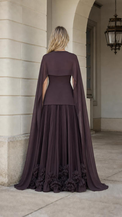 Back view showcasing flowing cape overlay