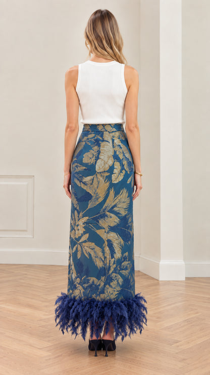 Back view of model in Teal Blue botanical jacquard maxi skirt with feather hem