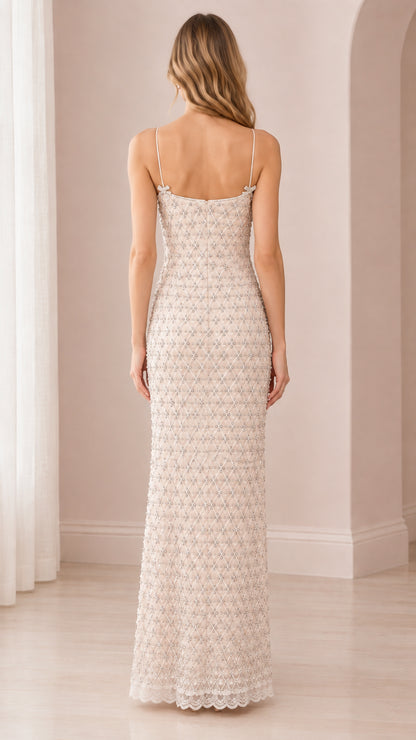 Back view of elegant champagne spaghetti strap beaded maxi dress