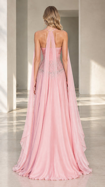 Back view of pink halter evening dress highlighting back cape details and flowing train