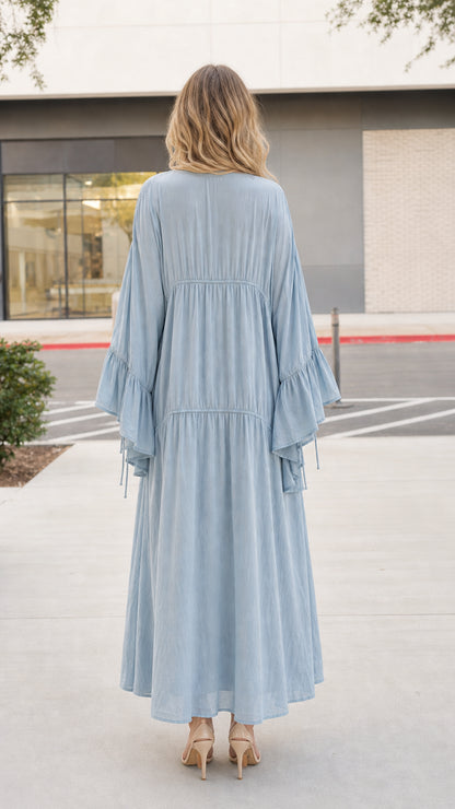 Model wearing light blue boho dress and kimono set, back view
