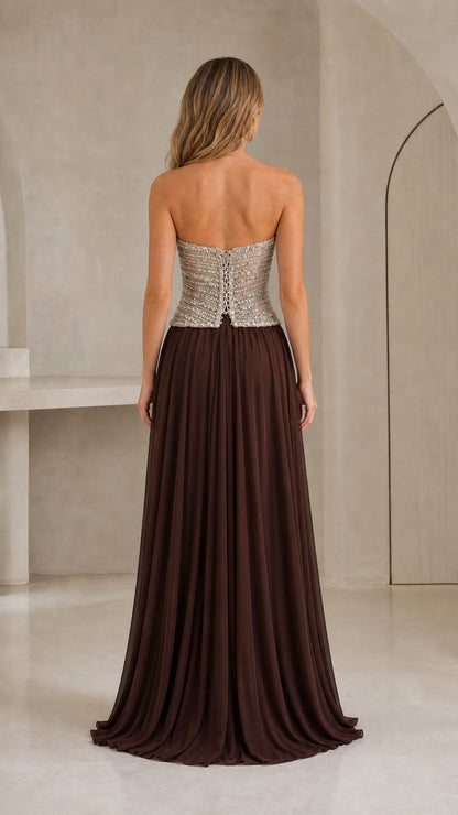 Back view of strapless chocolate brown chiffon gown showing structured bodice