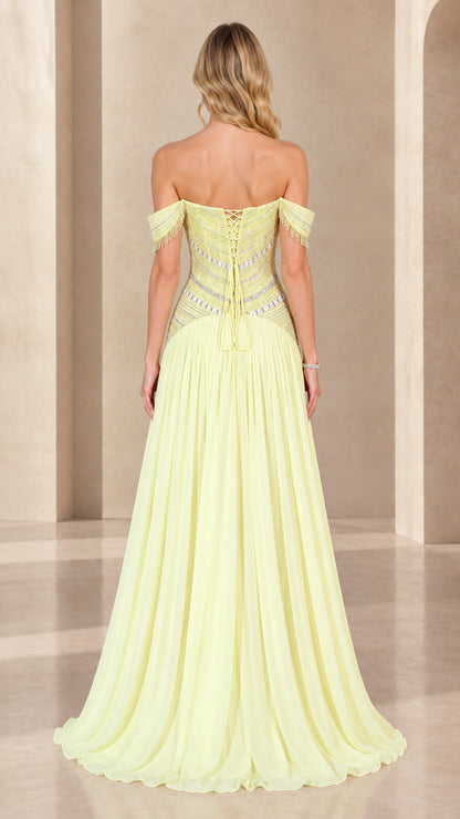 Back view of pastel yellow evening gown highlighting lace-up corset detail