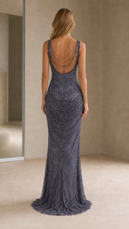 Back view of model showing beaded scoop back detail on evening gown