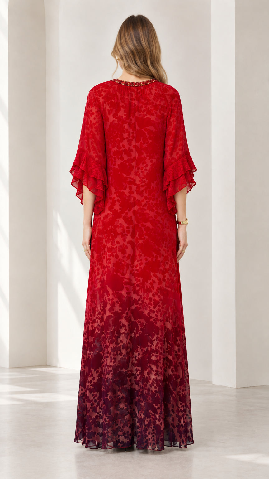 Back view of model in Ruby Red maxi dress showing continuous graceful silhouette