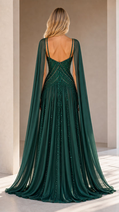 Back view of model in emerald green open-back cape formal gown