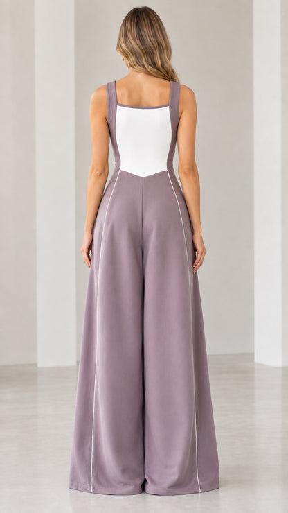 Back full-length view of woman wearing mauve colorblock cutout wide-leg jumpsuit