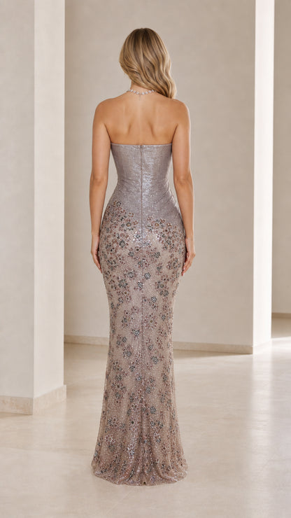 Back view of the silver floor-length strapless evening gown