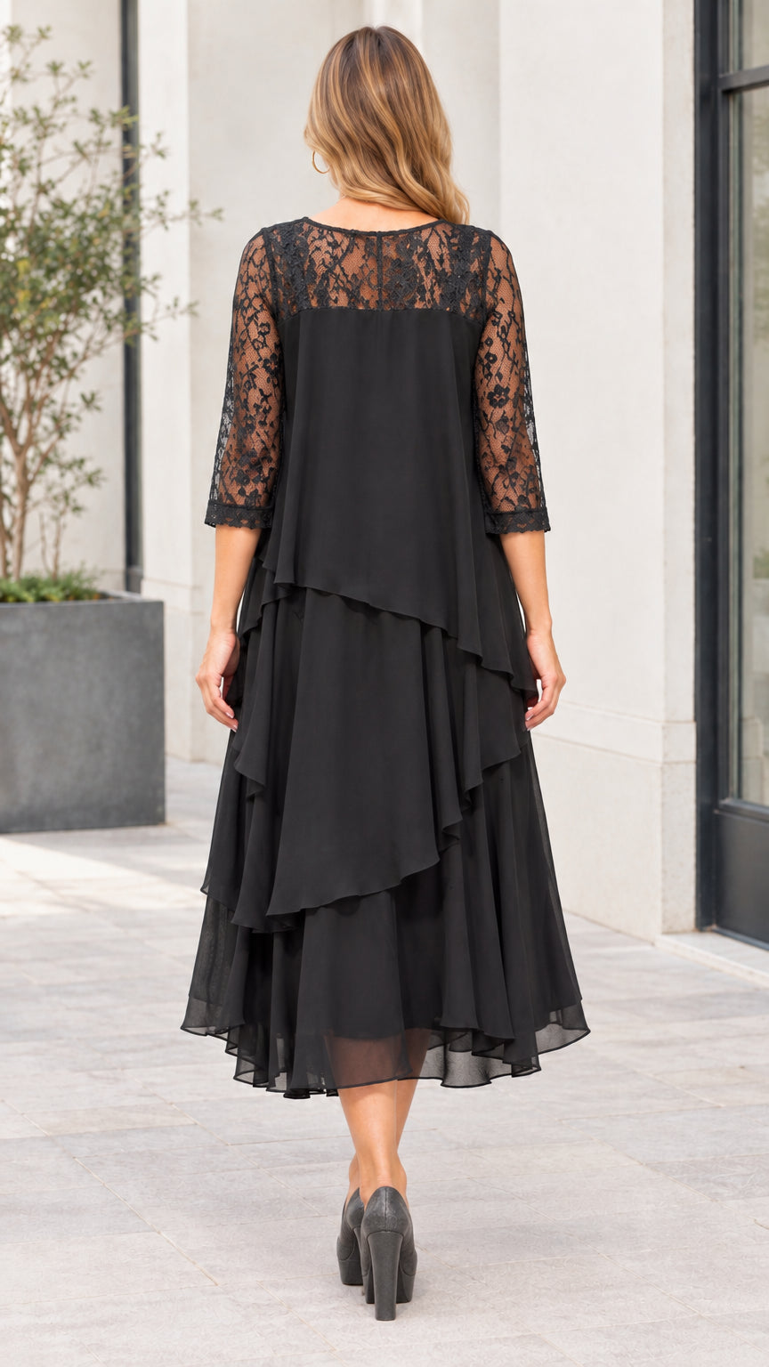 Back view of black tiered chiffon dress showing sheer lace upper panel