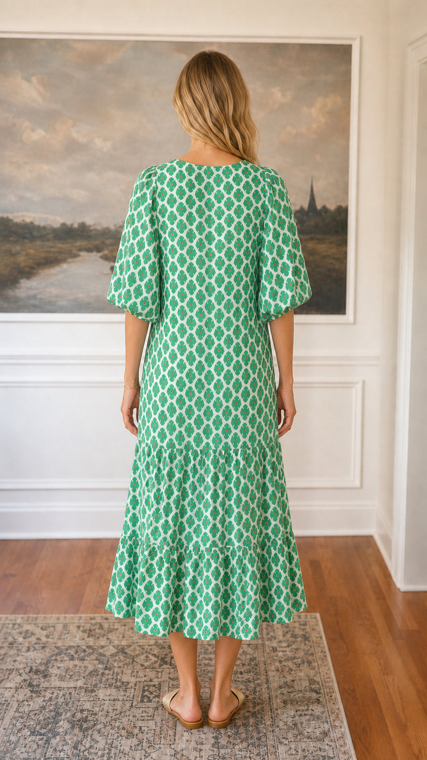 Back view of green floral tiered midi dress