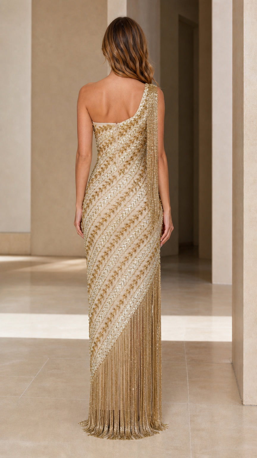 Back view of champagne gold sequined one-shoulder maxi gown