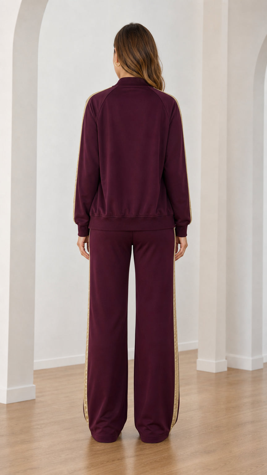 Back view of burgundy zip-up bomber jacket and wide-leg sweatpants set