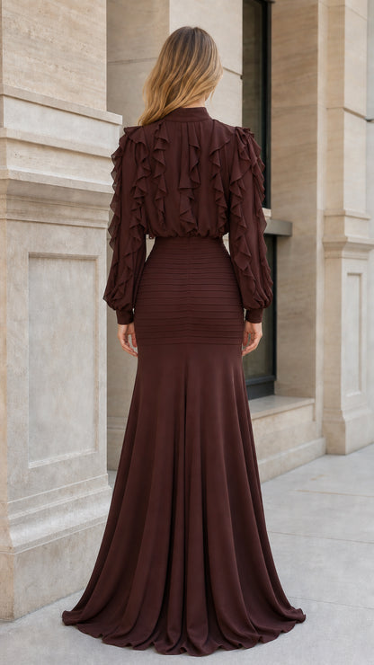 Back view of woman in brown ruffled maxi dress