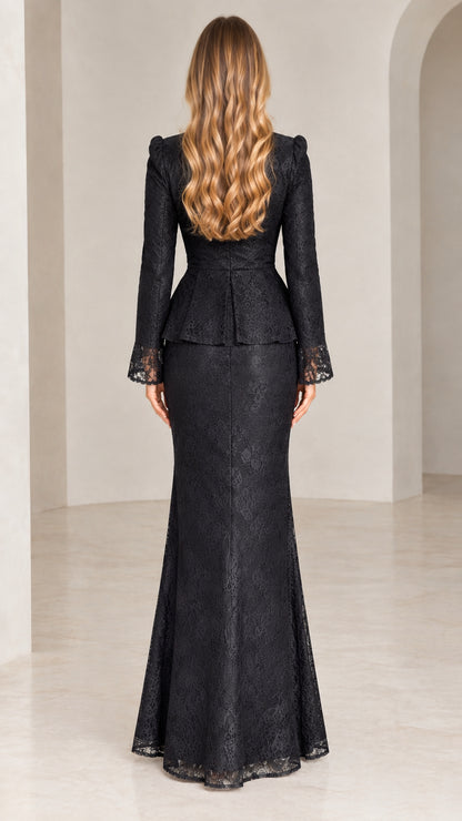 Rear view of woman wearing black lace peplum jacket and long formal mermaid skirt