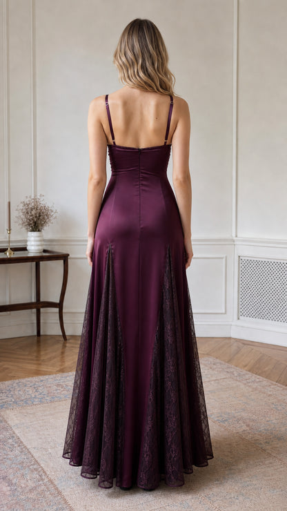 Back view of model wearing burgundy satin floor length dress with low back