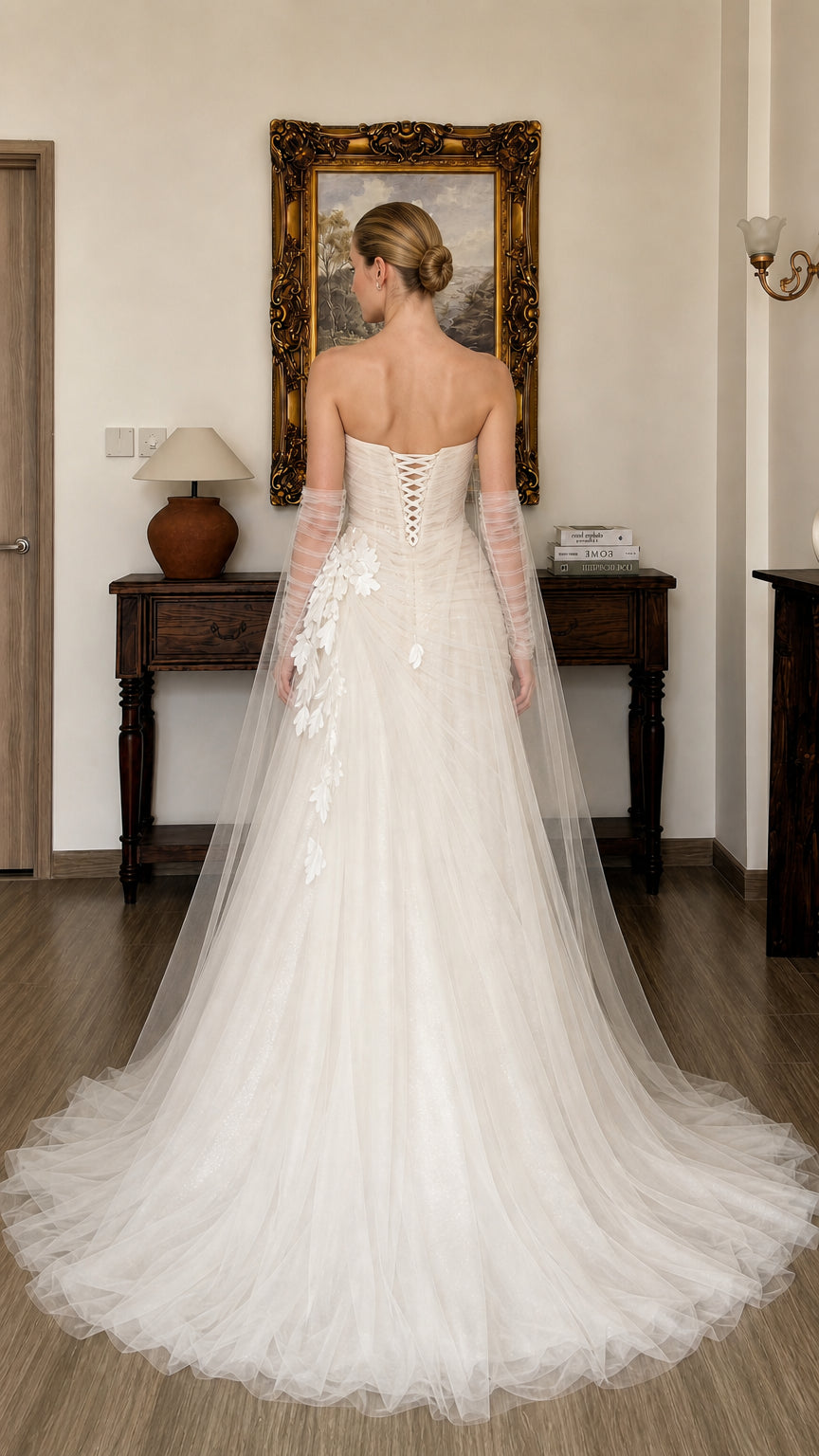 Back view of white tulle gown showing lace-up corset detail