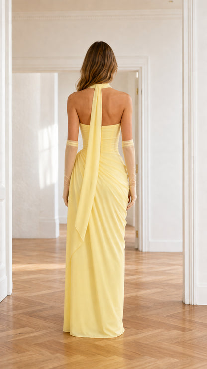Back view of pastel yellow floor-length maxi dress with long neck scarf