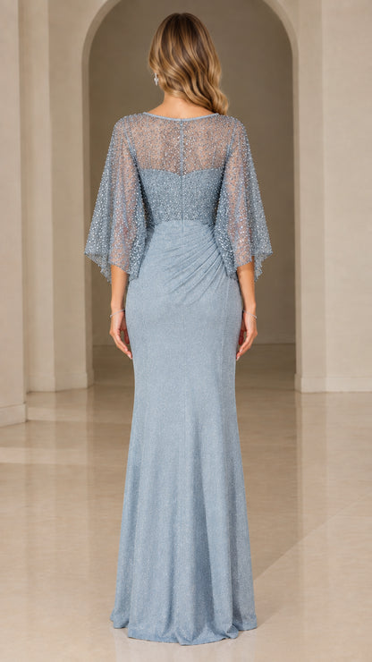 Back view of dusty blue sequined evening gown with capelet flutter sleeves