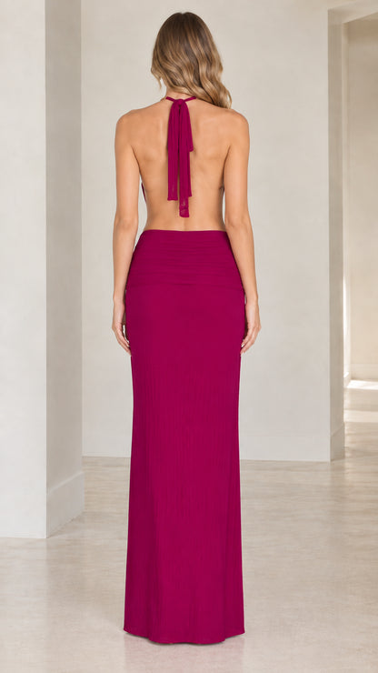 Back view showing halter tie and open back design on the magenta evening dress