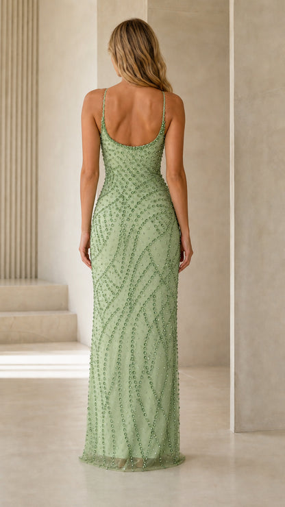 Back view of model wearing sage green beaded evening dress