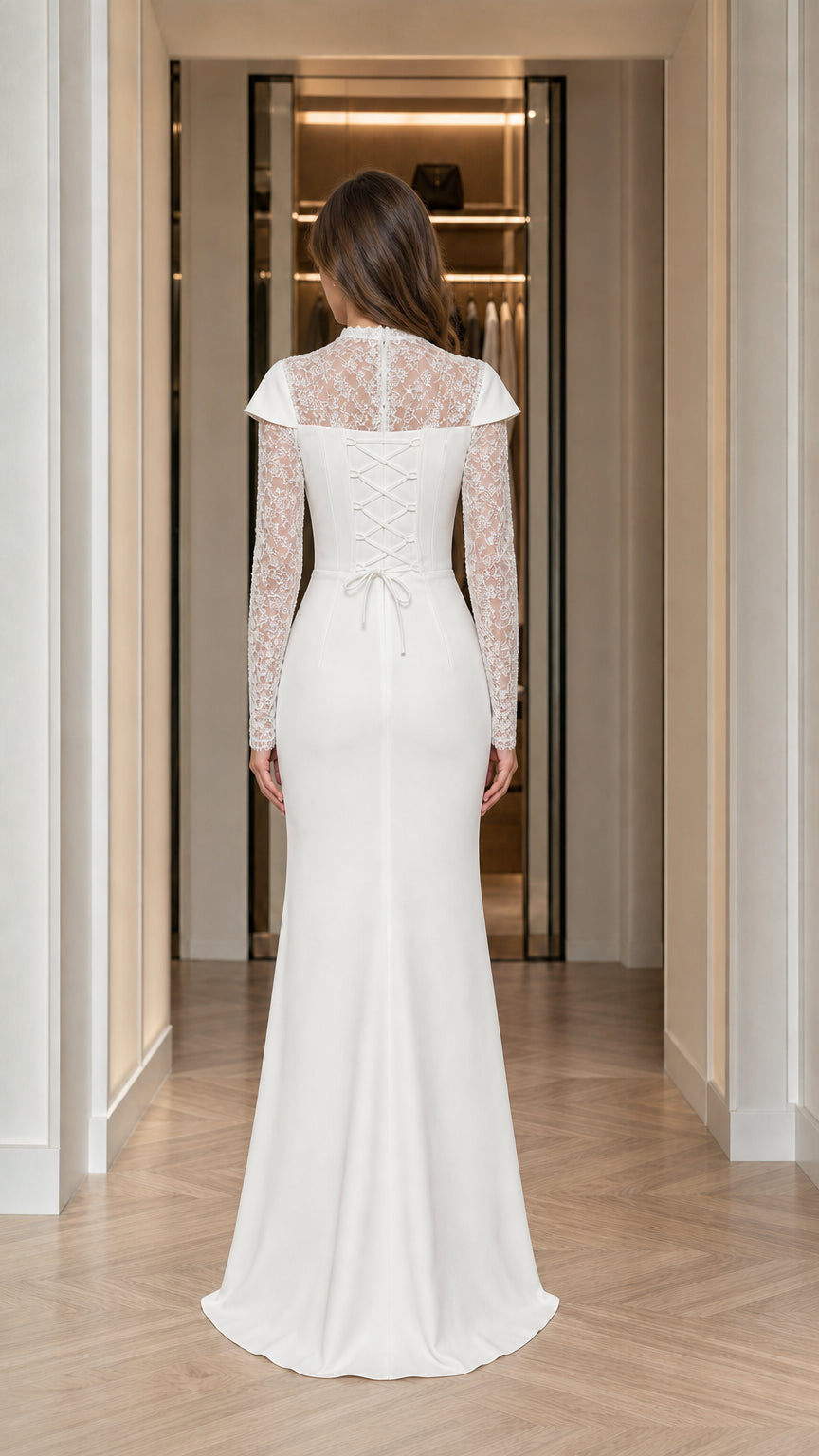 Back view of white formal gown highlighting the lace back and lace-up corset tie detail