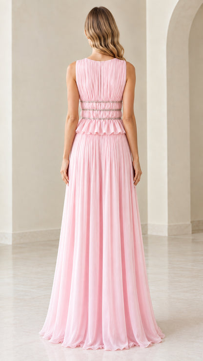Back view of model in pink sleeveless pleated maxi dress