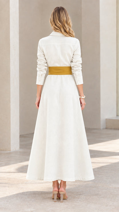 Back view of model in elegant long cream maxi dress with tie belt