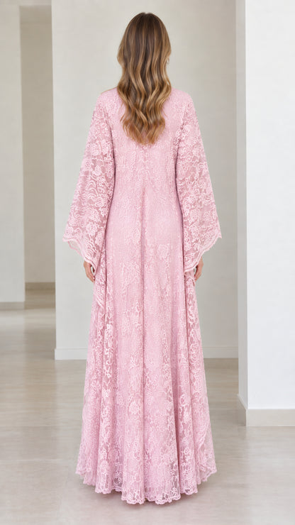Back view of model wearing pink lace maxi gown showing floor-length flowing cut