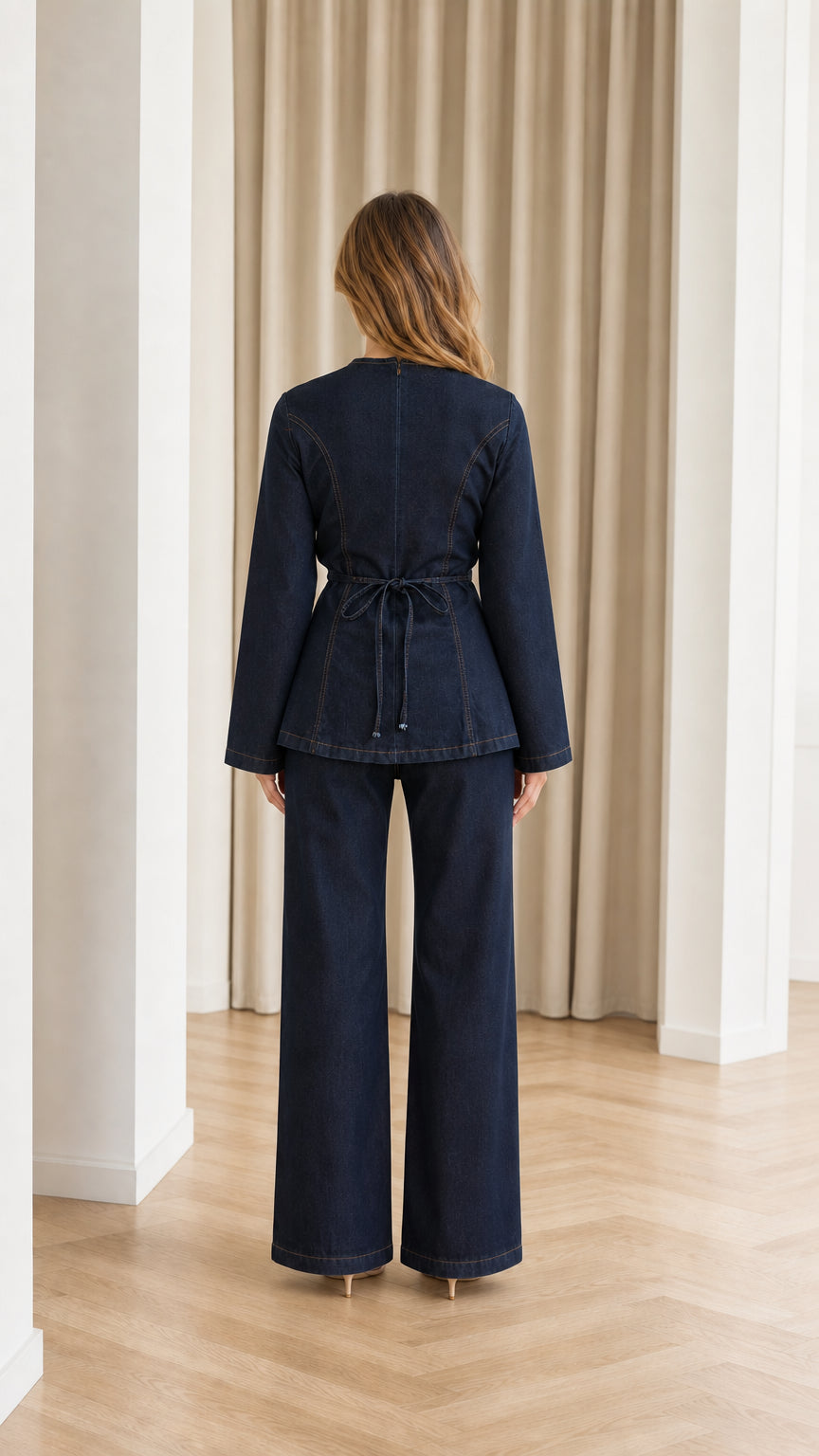 Back view of woman showing adjustable waist ties on Dark Blue denim two-piece set