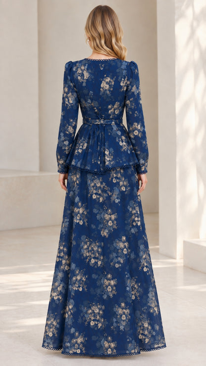 Back view of model wearing Navy Blue belted floral maxi dress with peplum detail