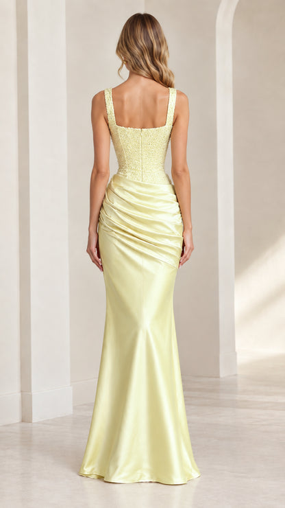 Back view of model in pastel yellow floor-length satin formal dress