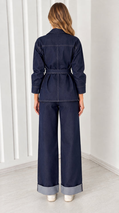 Back view of model wearing Dark Indigo belted jacket and wide-leg pants set
