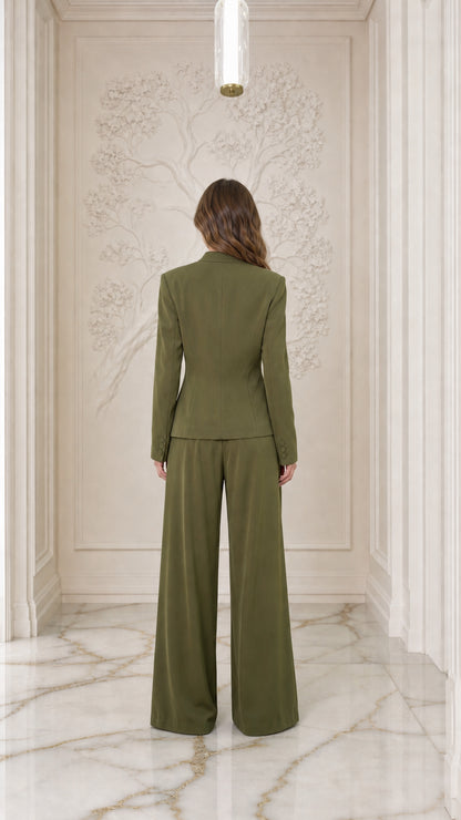 Back view of woman wearing Olive Green jacket and wide-leg trousers
