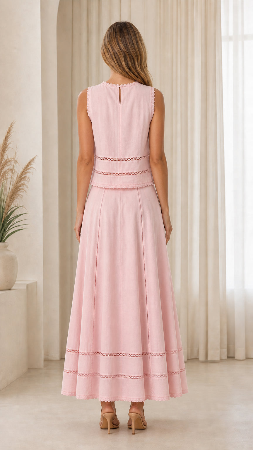 Back view of woman wearing pink two-piece set