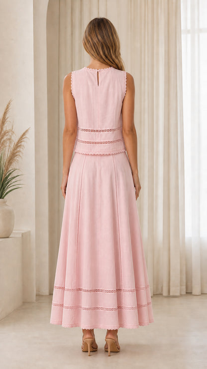 Back view of woman wearing pink two-piece set