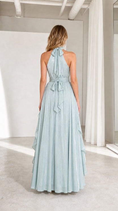 Back view of model showing halter neck tie and pleated back of sage green dress