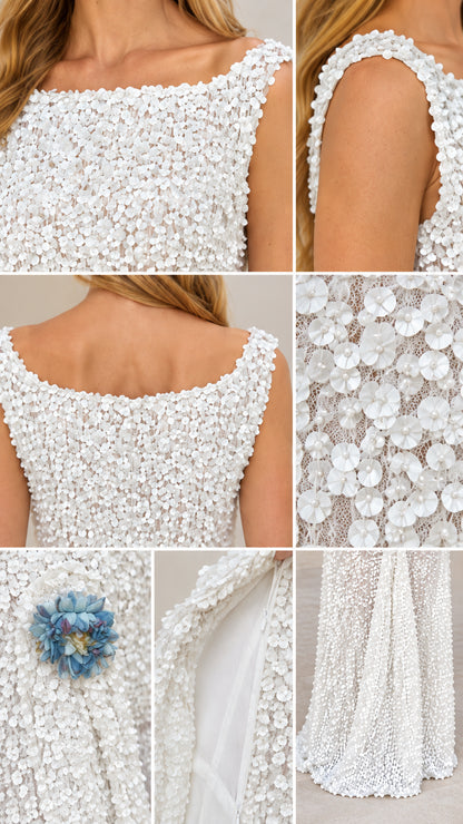 Close-up details of the white textured 3D floral petals, sequin embellishments, and corsage accent