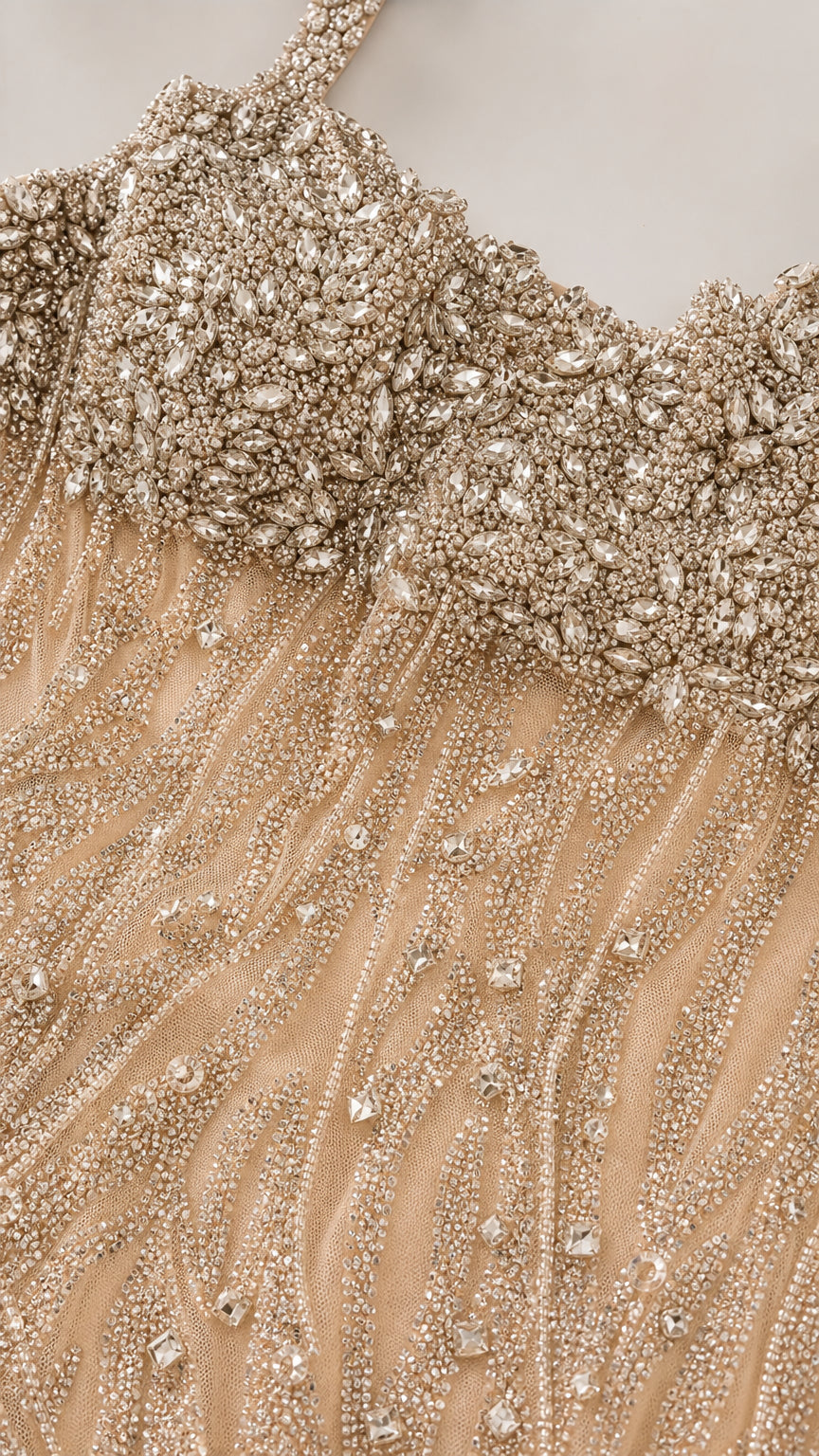 Close-up detail of crystal and bead embellishments on bodice